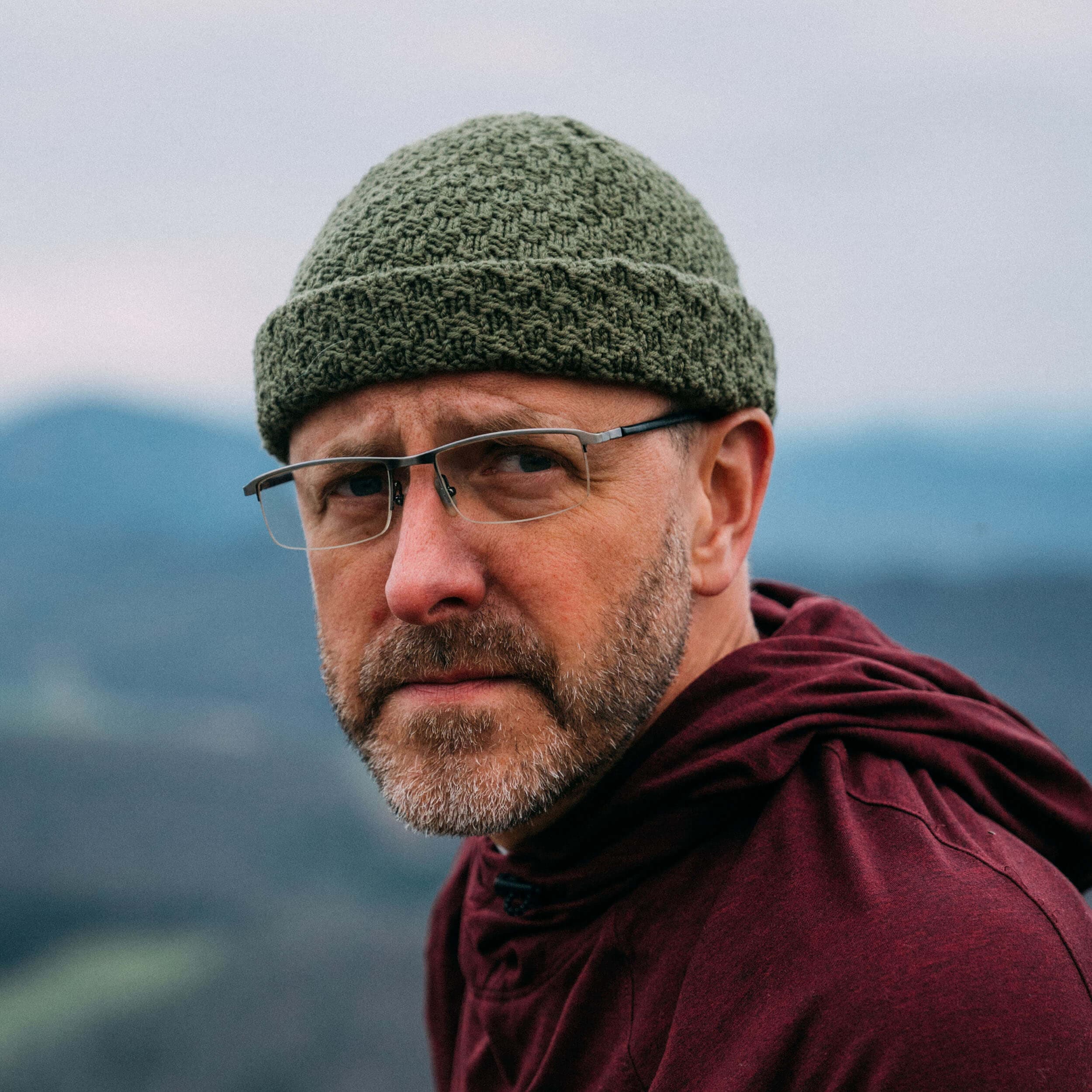 The Eastfold – hand knit merino wool beanie, olive, portrait