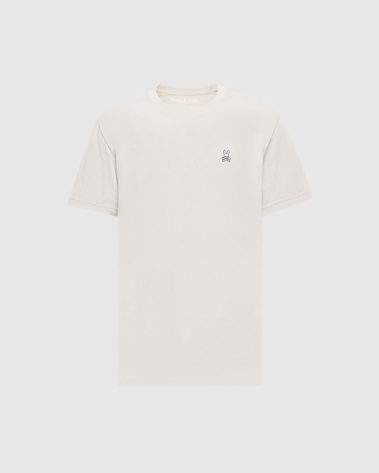 The Psycho Bunny Men's Classic Crew Neck Tee (B6U014B200) in light beige is a premium Pima cotton shirt with short sleeves and an embroidered bunny logo on the upper left chest. Set against a simple white background, it embodies timeless appeal.